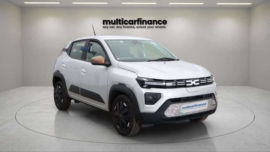 A white 2025 Dacia Spring electric crossover with automatic transmission, available on PCP and HP finance at MultiCar Finance, showcasing its compact design and eco-friendly appeal.