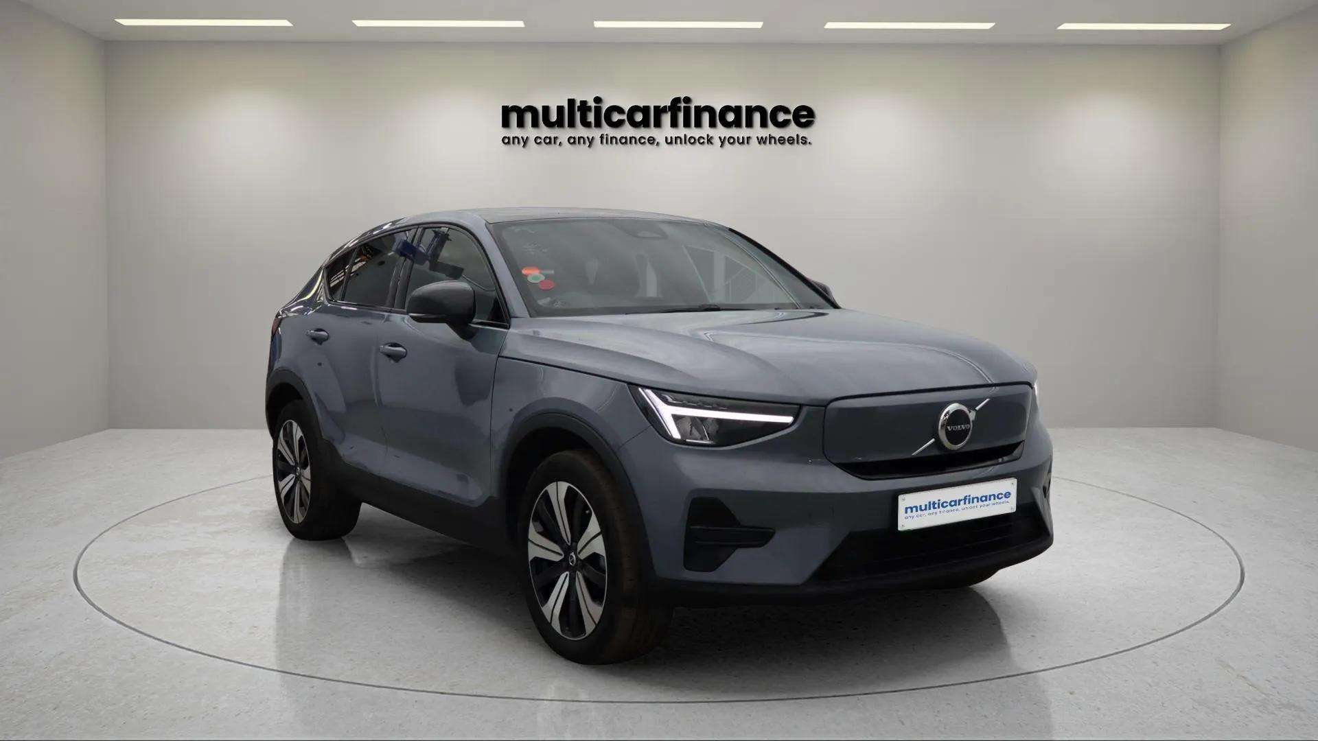 A dark grey 2023 Volvo C40 Recharge electric crossover with automatic transmission, available on PCP and HP finance at MultiCar Finance, showcasing its sleek design and eco-friendly appeal.