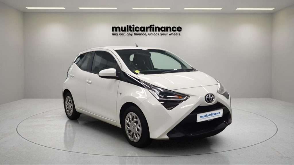 A white 2020 Toyota Aygo petrol hatchback with manual transmission, available on PCP and HP finance at MultiCar Finance, showcasing its compact design and vibrant appeal.