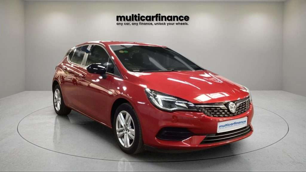 A red 2021 Vauxhall Astra petrol hatchback with manual transmission, available on PCP and HP finance at MultiCar Finance, showcasing its bold design and dynamic appeal.