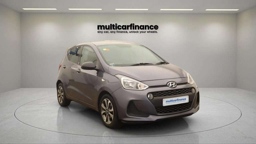 A grey 2019 Hyundai i10 petrol hatchback with manual transmission, available on PCP and HP finance at MultiCar Finance, showcasing its compact design and practical appeal.