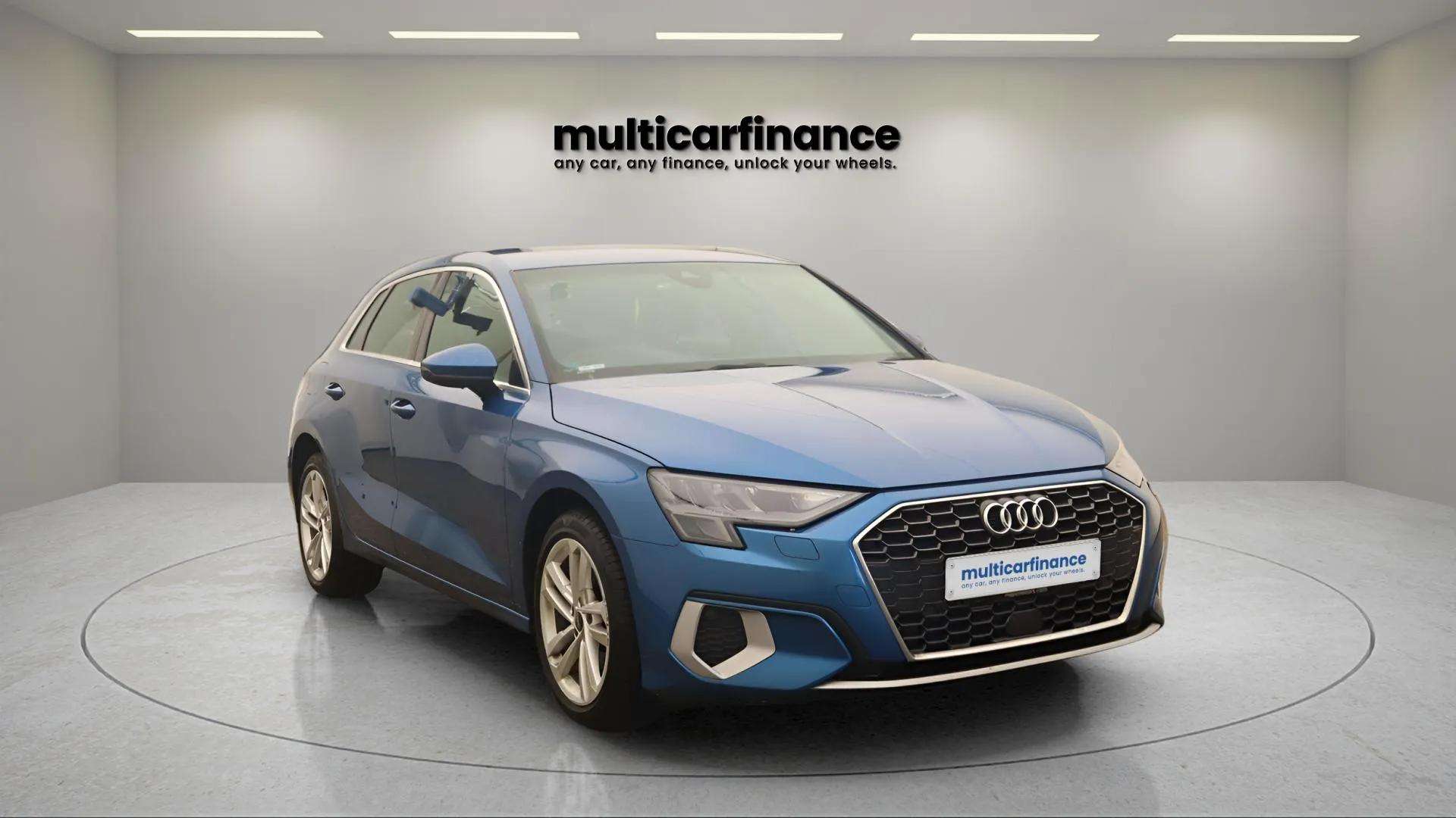 A blue 2022 Audi A3 Sportback hybrid hatchback with automatic transmission, available on PCP and HP finance at MultiCar Finance, showcasing its sleek design and eco-friendly appeal.