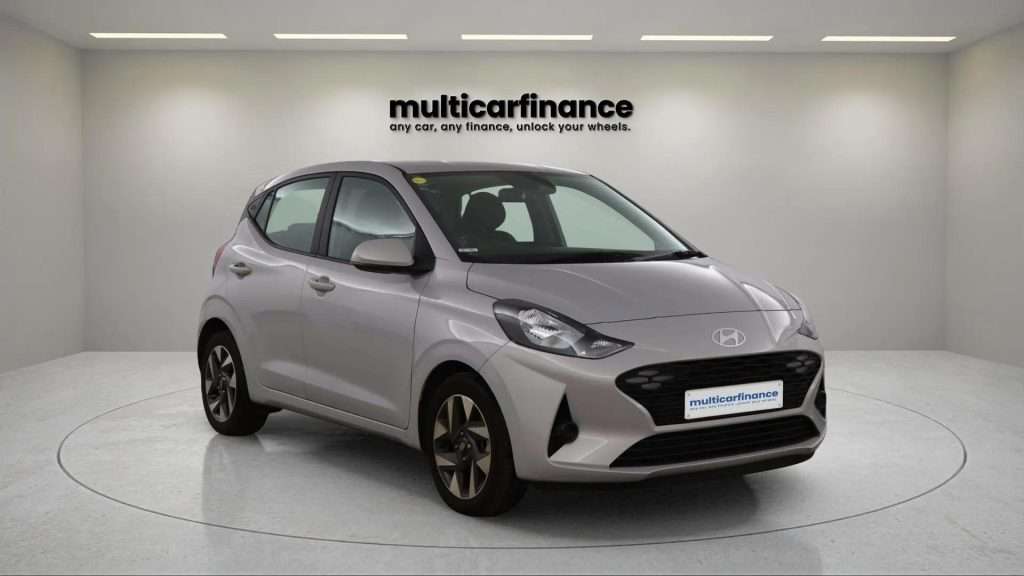 A grey 2024 Hyundai i10 petrol hatchback with manual transmission, available on PCP and HP finance at MultiCar Finance, showcasing its sleek design and urban appeal.