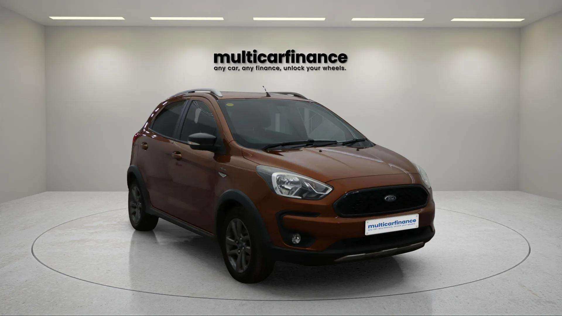A brown 2018 Ford KA+ Active petrol crossover with manual transmission, available on PCP and HP finance at MultiCar Finance, showcasing its rugged design and practical appeal.