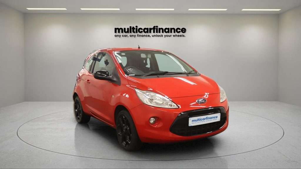A red 2016 Ford KA petrol hatchback with manual transmission, available on PCP and HP finance at MultiCar Finance, showcasing its compact design and vibrant appeal.