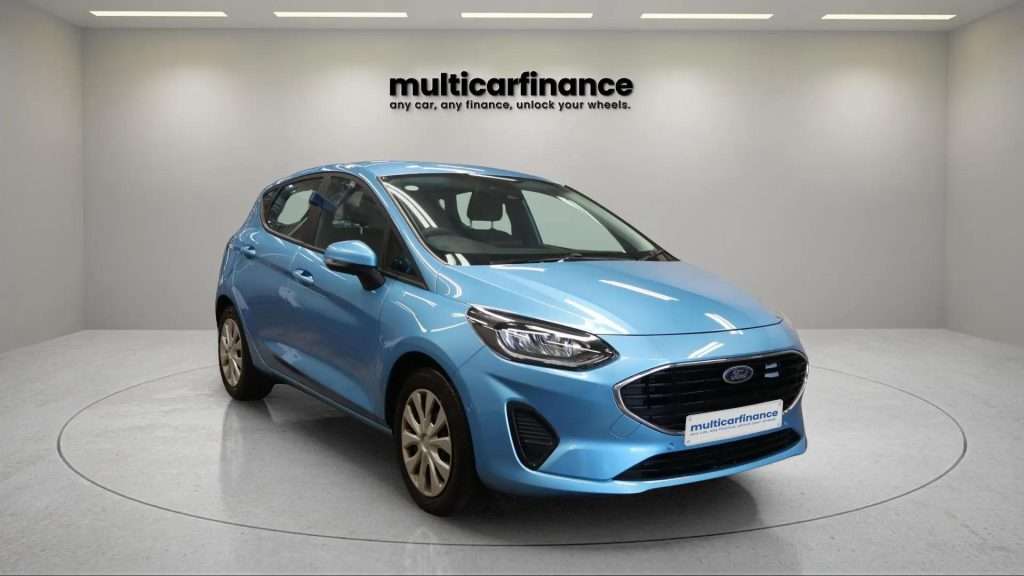 A blue 2022 Ford Fiesta petrol hatchback with manual transmission, available on PCP and HP finance at MultiCar Finance, showcasing its sporty design and urban appeal.