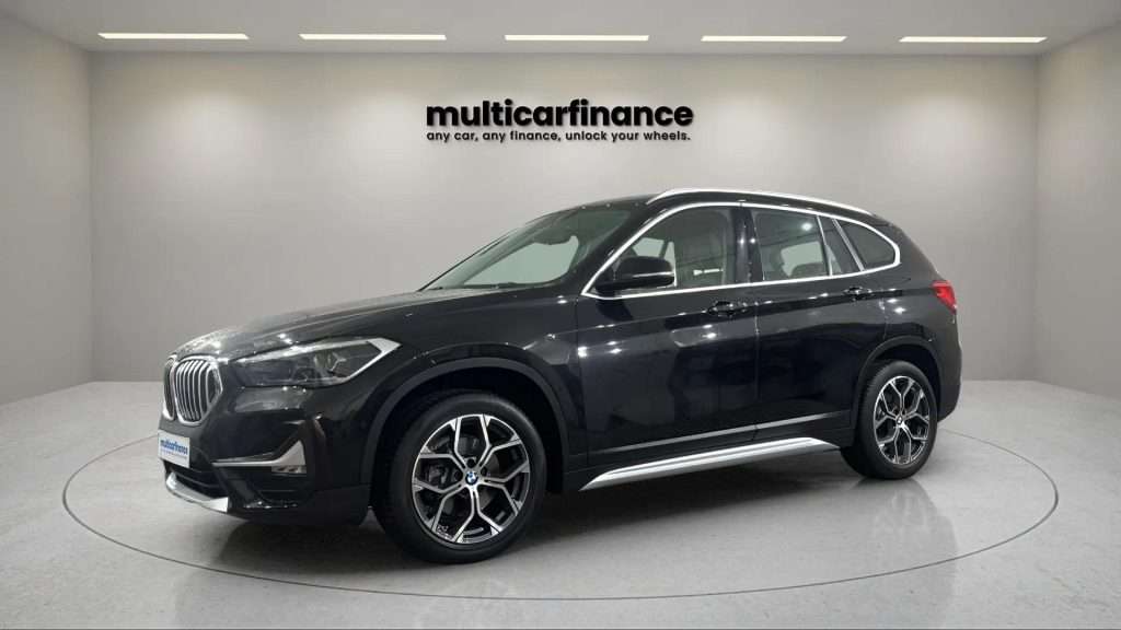 BMW X1 2021 black SUV front three-quarter